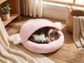 Cozy Cave Cat Bed — cat sleeping peacefully inside warm semi-enclosed hideaway